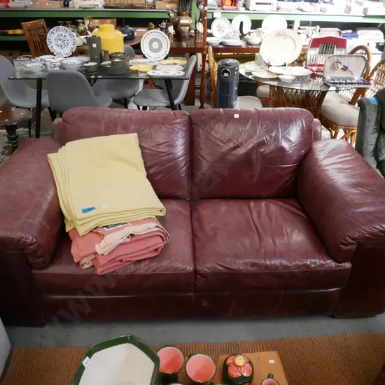 red leather 2 seater settee - some wear