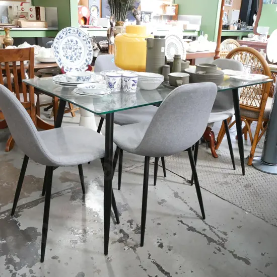 modern glass top table with 4x grey chairs H-760 W-140 D-800