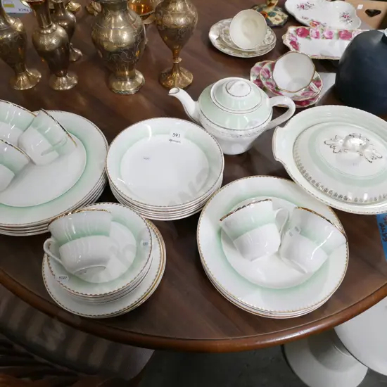 assorted Portland pottery green, cream dinner items