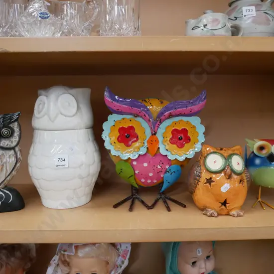 shelf of owl figurines