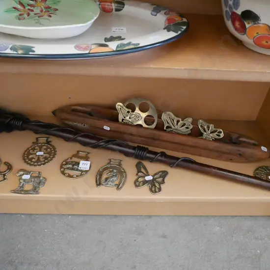 shelf; horse brasses, brass ornaments, carved walking stick etc