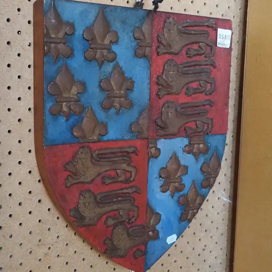 carved wooden shield/coat of arms