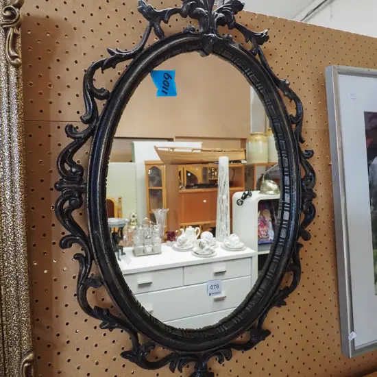 ornate reproduction cast metal oval wall mirror