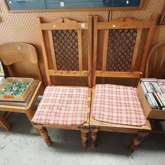 2x unusual Indonesian hardwood chairs with turned legs, metal frieze back and cushions