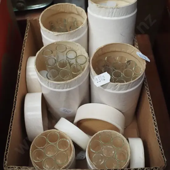 box of test tubes - some without lids