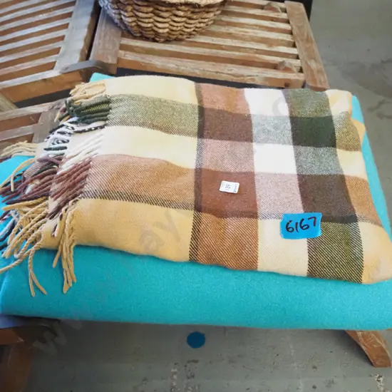 teal woollen blanket, brown travel rug