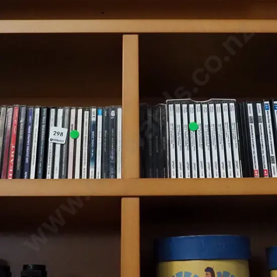 2x shelves of CDs - green dots