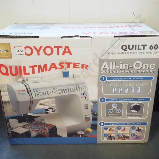 boxed Toyota Quiltmaster sewing machine