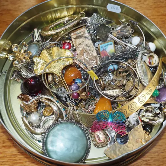 tin of costume jewellery
