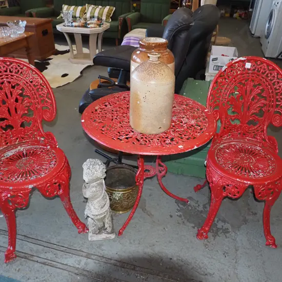 red painted cast alloy patio table with 2 chairs