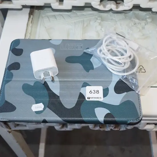 small tablet in UAG case with charger
