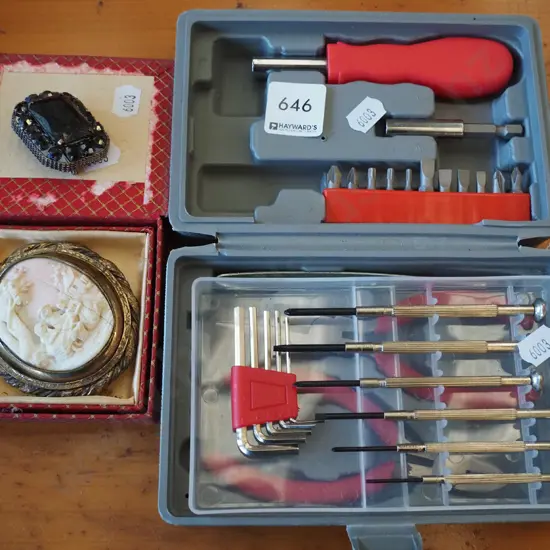screwdriver and tool set, carved bone brooch, 1 other brooch