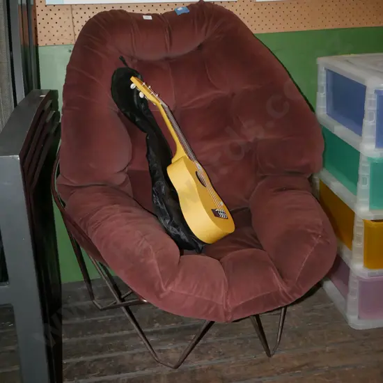 brown velour upholstered deep buttoned armchair