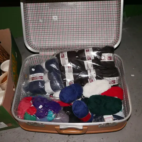 retro mustard suitcase of knittting yarn