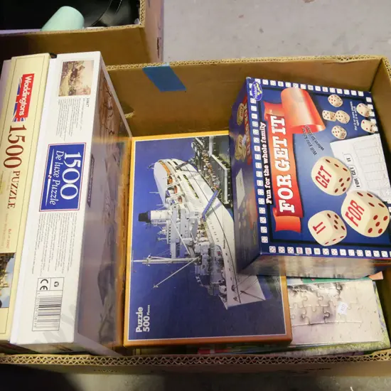 box of board games and puzzles