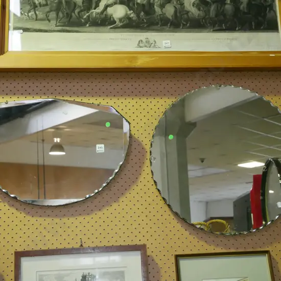 2x scalloped edge wall mirrors - some tarnishing and silvering