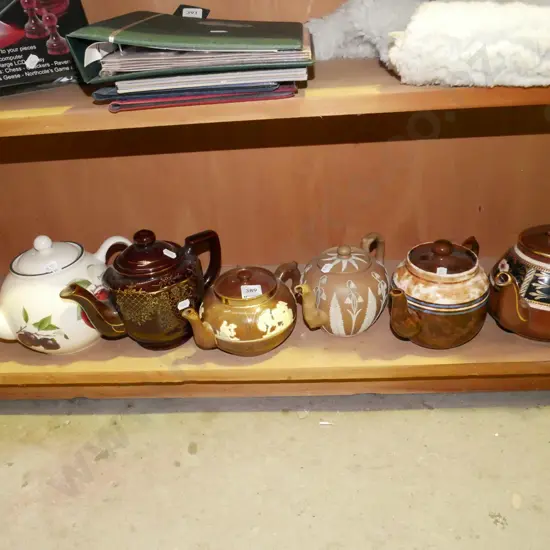 shelf of 6 teapots
