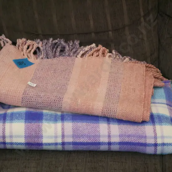 blue checked blanket, 1 other blanket