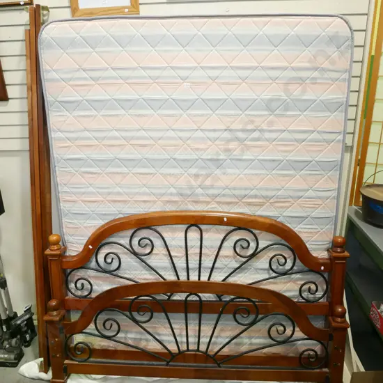 slat based queen bed and mattress with metal and wood ends