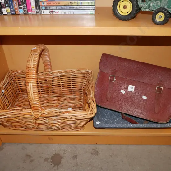 cane basket, leather satchel, speckled enamel baking dish