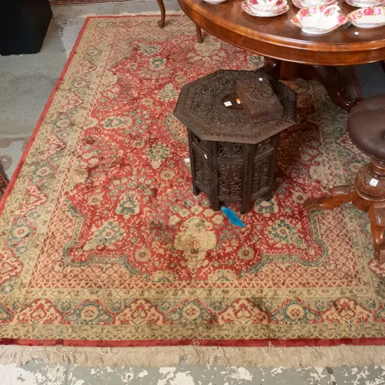large Persian style wool floor rug in gold, green and red (remnant label Tiger brand, natural fibre) Some fading and