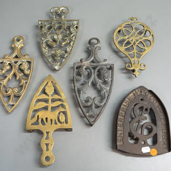 6 vintage trivets with pierced decoration - one cast iron marked "Enterprise Mfg. Co. Phila. USA" 4 brass, etc.
