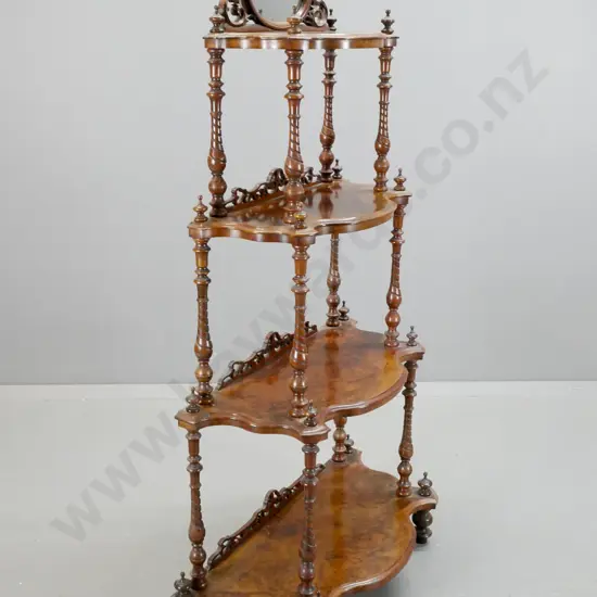 Victorian walnut 4-tier whatnot with serpentine shape fronts, twist turned supports with finials, oval mirror and