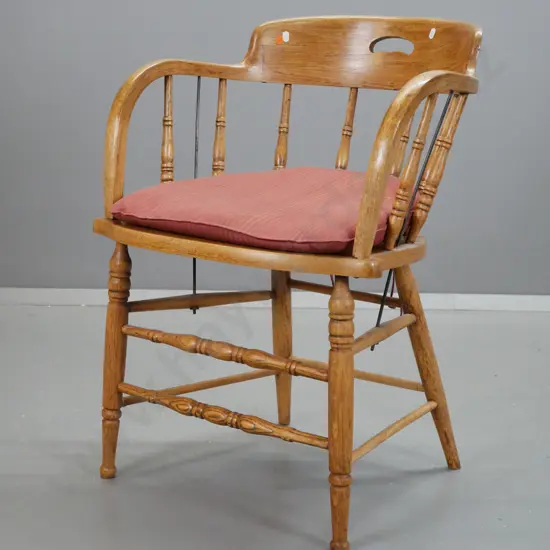 vintage oak Douglas chair with cutout hand hold, turned spindles, cane mat seat, on stretcher base, with loose seat