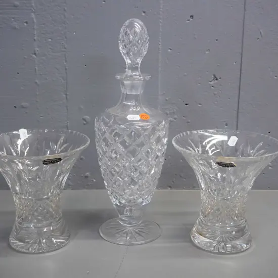 3 pieces of cut crystal - pair of vases with Harbridge labels and a stoppered decanter H-320