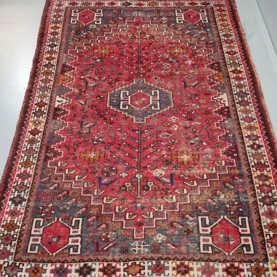 Persian style hand-knotted woollen floor rug - reds, blues, browns and beige - some fading, heavy wear L-2400 W-1710