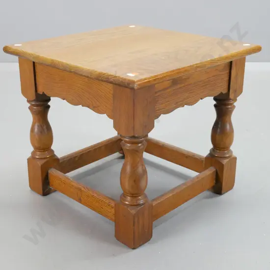 oak stretcher-based end table with turned legs, block feet and shaped aprons - some paint flecks, wear to top surface.