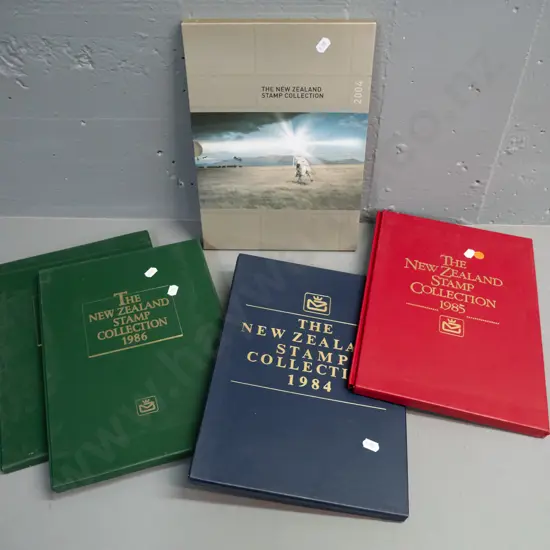 5 New Zealand stamp annual collector's albums - 1984, 1985, 1986 x 2 and 2004