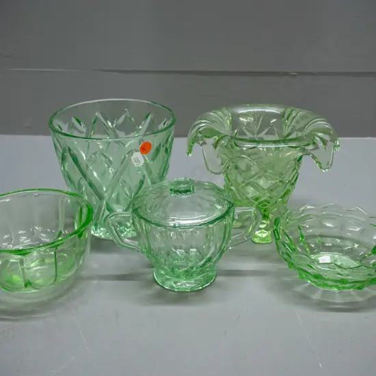 5 pieces of green depression glass - 2 flower vases, 2 dishes and a lidded sugar bowl. Larger vase is H-130 D-135