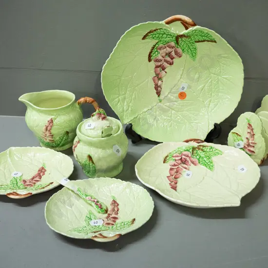 Carlton Ware green glaze foxglove pattern items - toast rack, lidded jam pot with spoon, jug, 3 dishes and a butter