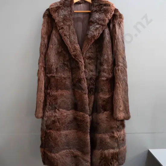 full length dark reddish brown fur coat with Mooney's Made in New Zealand label