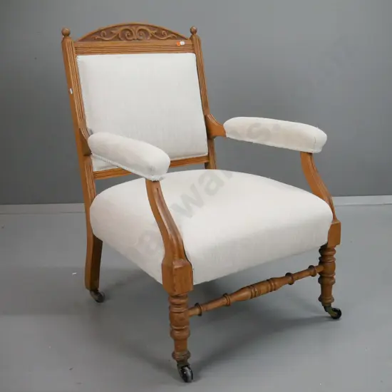 art nouveau open-arm armchair with, fluted uprights and arms, turned legs and stretchers on porcelain casters - minor