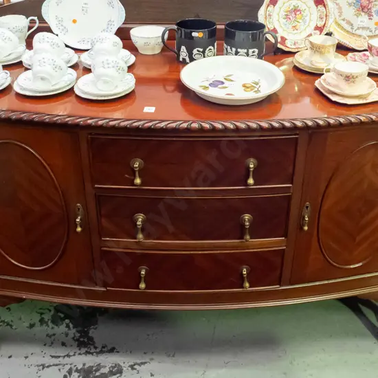 vintage mahogany bow-front buffet sideboard with gadrooned edge, 3 drawers with brass drop handles, 2 doors, quartered