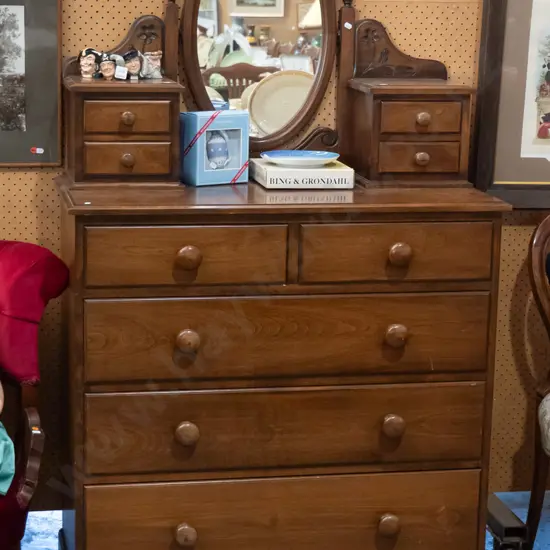 Victorian style beech dresser with oval mirror and box supports with 4 drawers on top, 5 below, with wooden knobs. Some