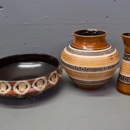 3 pieces of German incised earth tone pottery - 2 matching pattern vases, larger is H-160 D-160, and a shallow bowl with