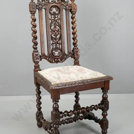 Victorian oak Jacobean-style hall chair with foliate carved crest and pierced panel, twist stretcher base and supports,