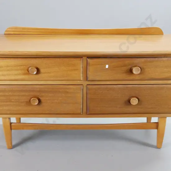 mid-century mahogany low 4-drawer chest with inset wooden knobs, stretcher base, minor marks to top. H-685 W-1170 D-430