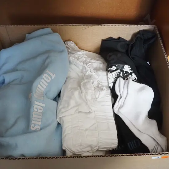 Blue hoodie, bunch of black socks, white pants and black huffer shirt.