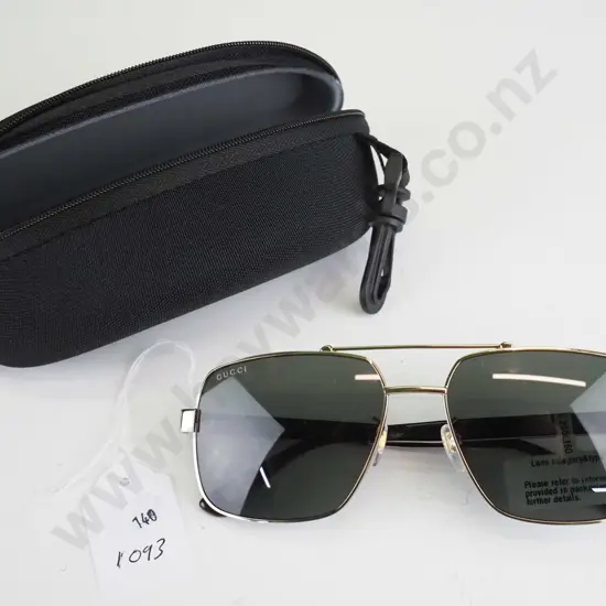 Gucci gold framed glasses with tag attached