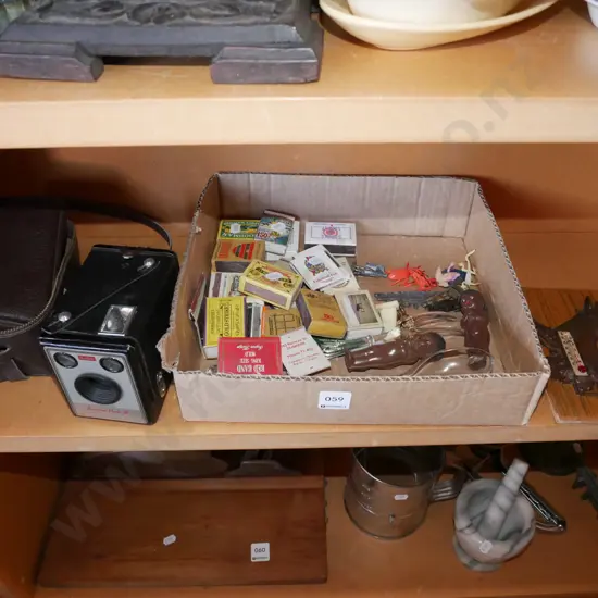 shelf; boxed brownie, matchboxes, horse thermometer