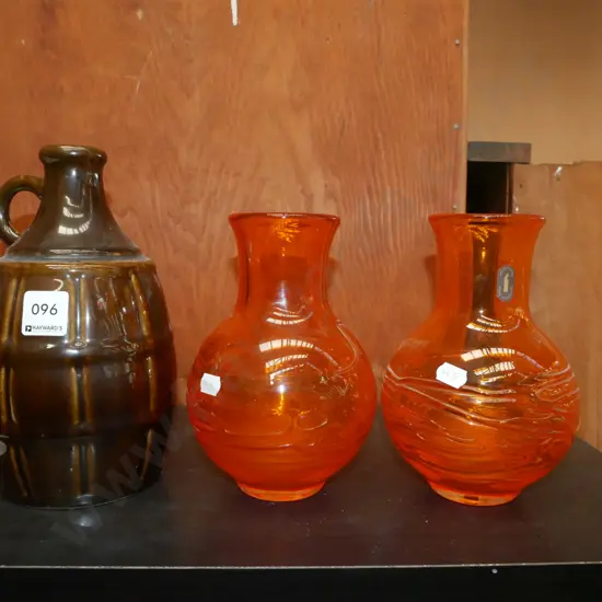 2 orange glass vases and a glazed bottle, no stopper