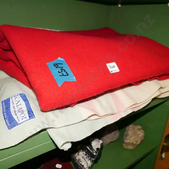 1x red, 1x cream woollen blankets