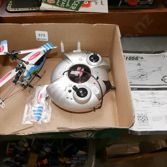 small blue and green remote control helicopter