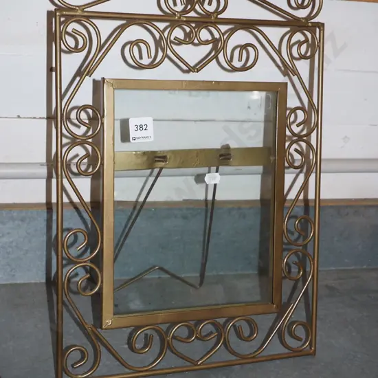 bent metal and glass photo frame