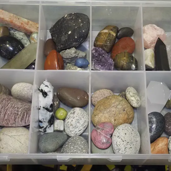 plastic organiser, polished and unpolished stones