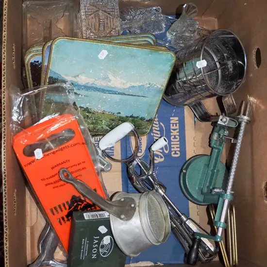 box; placemats, flour sifter, apple corer etc